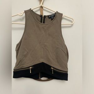 Women’s olive green crop top with black and zipper detail